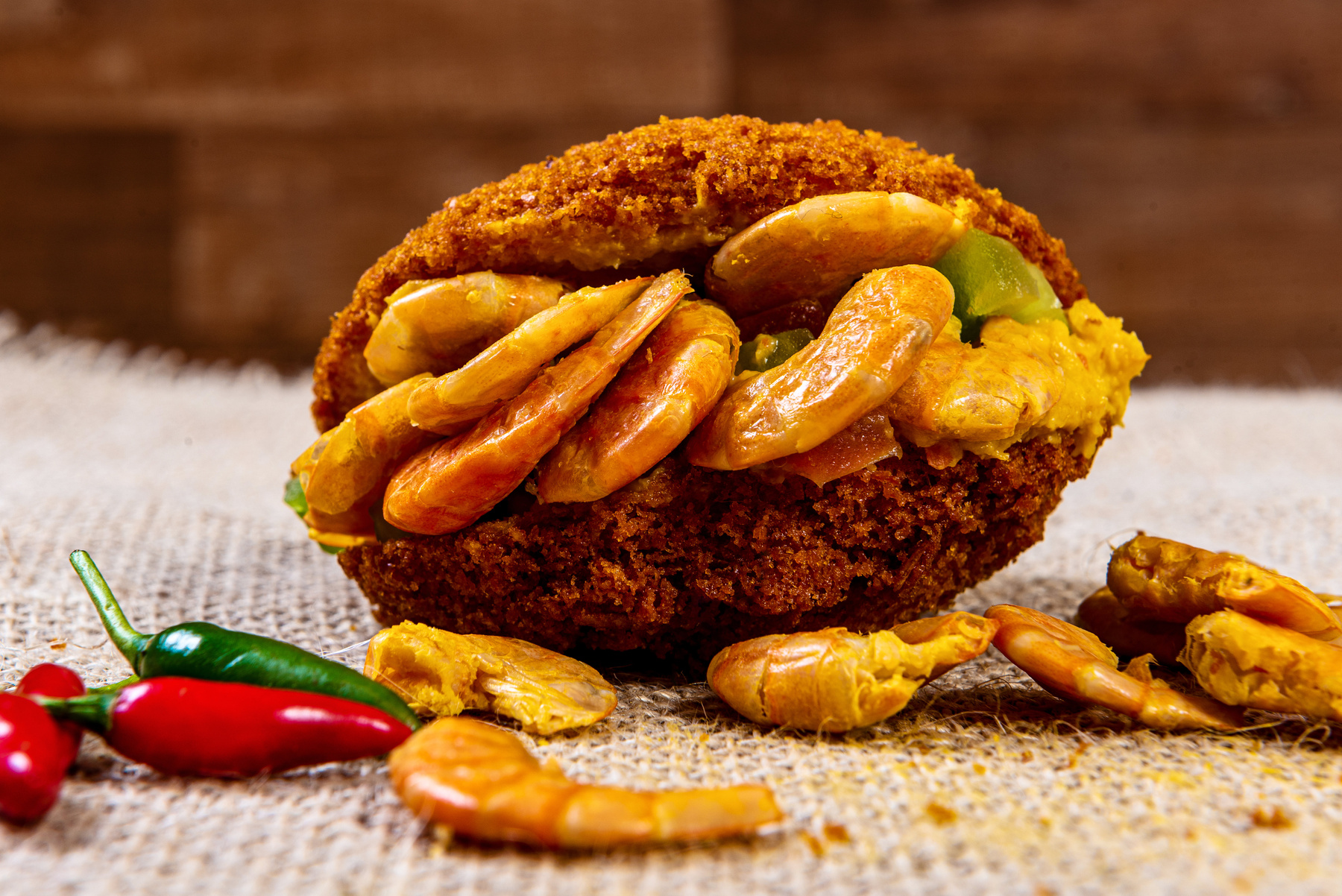 Acaraje - Traditional Brazilian dumpling made with black-eyed peas and onion stuffed with vatapa, caruru, tomato salad and shrimp. Typical foods from Bahia.